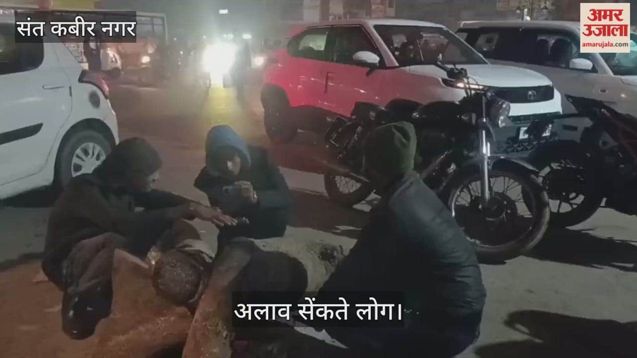 People were seen warming themselves by the bonfire as the evening fell.