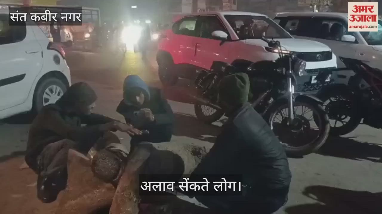 People were seen warming themselves by the bonfire as the evening fell.