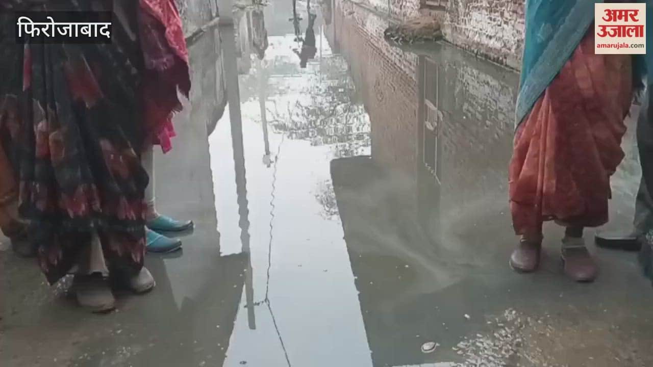 Villagers are forced to wade through dirty water