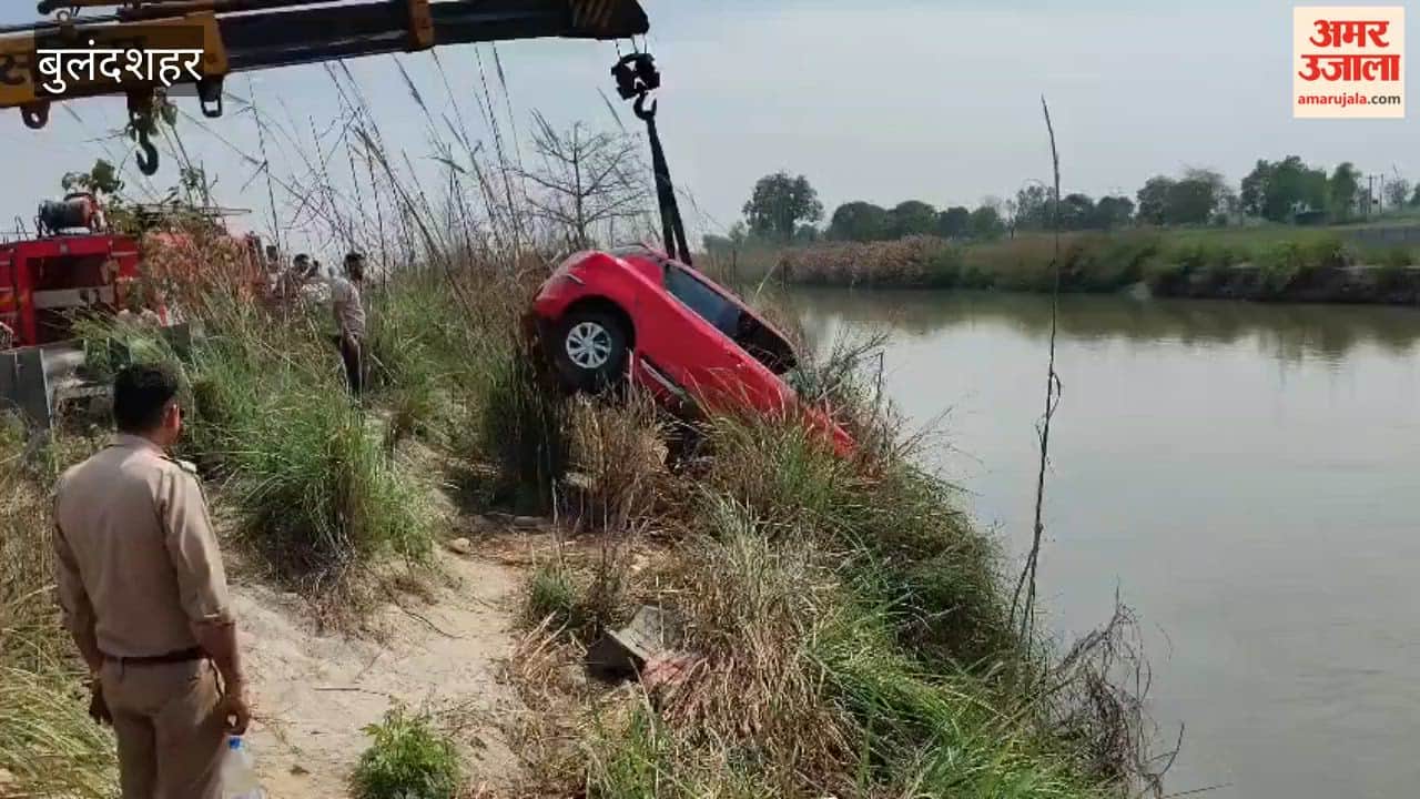 car hit a couple riding bike and fell into canal In Bulandshahr