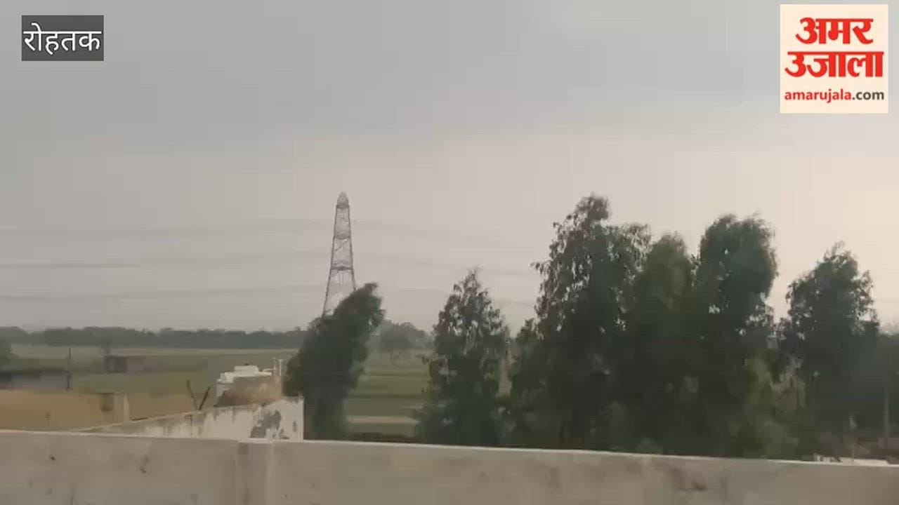 Heavy rain accompanied by strong winds in Rohtak.