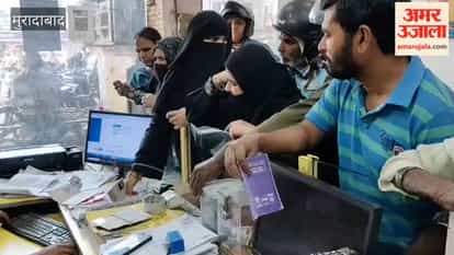 People arrive at the Bharat Gas agency in Ramganga Vihar to book cylinders