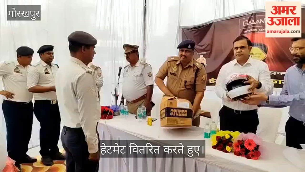 Helmets were distributed to traffic police as part of the National Safety Week.