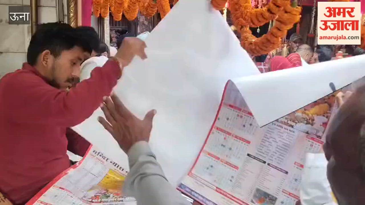 Una New Year calendars featuring Mata Rani distributed to devotees within the temple complex—an initiative by temple official Sanjeev Prabhakar