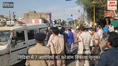 Police took out a procession of those accused of vandalizing a Dalit's house.