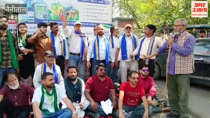 Organizations protest against smart meters at the UPCL office in Tikonia