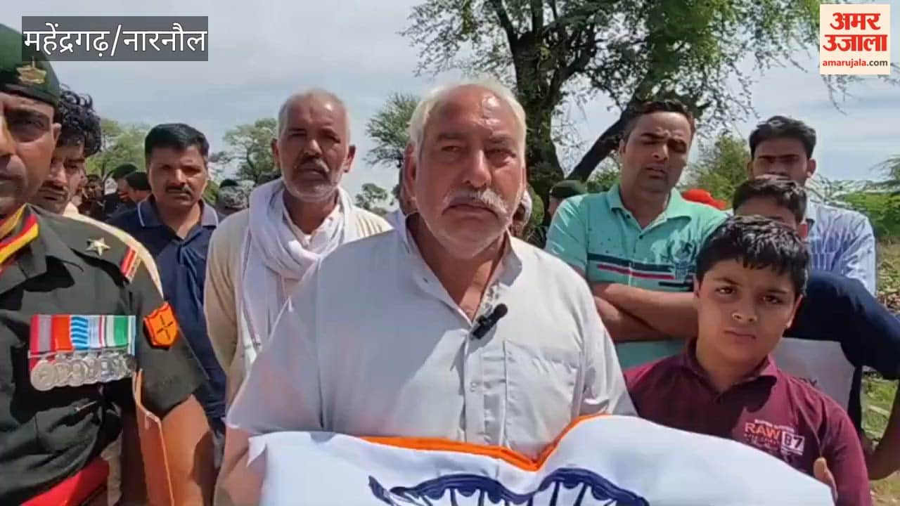 Ten-year-old son lit the funeral pyre of his heroic father.