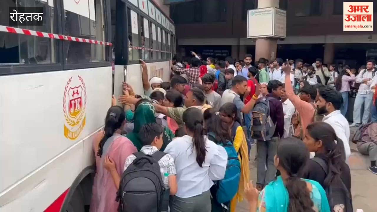 Passengers travelling on the roofs of buses
