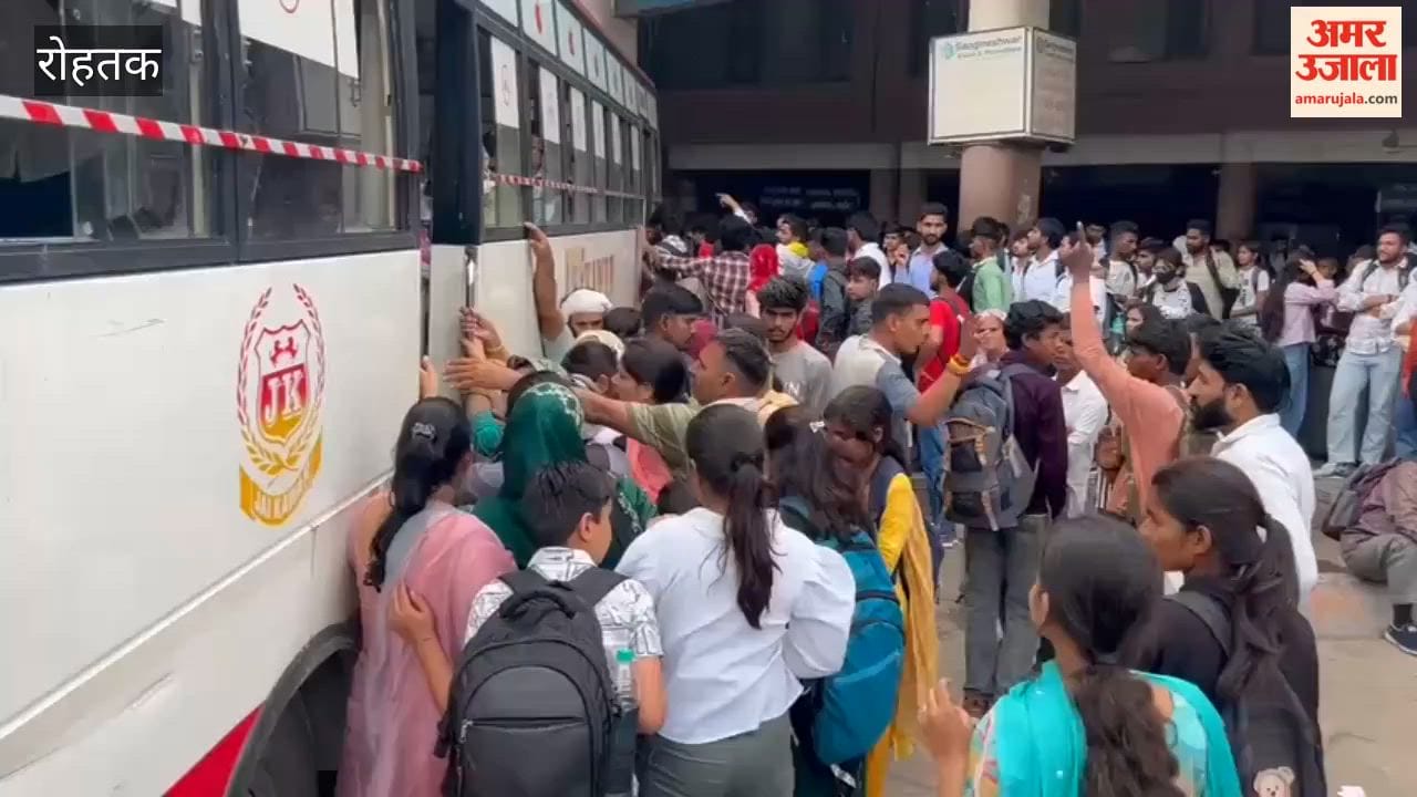 Passengers travelling on the roofs of buses