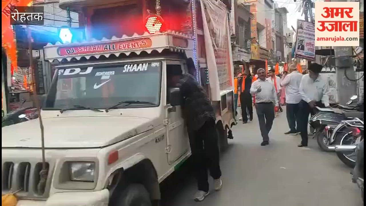 The city of Rohtak was immersed in devotion following a grand saffron vehicle procession.