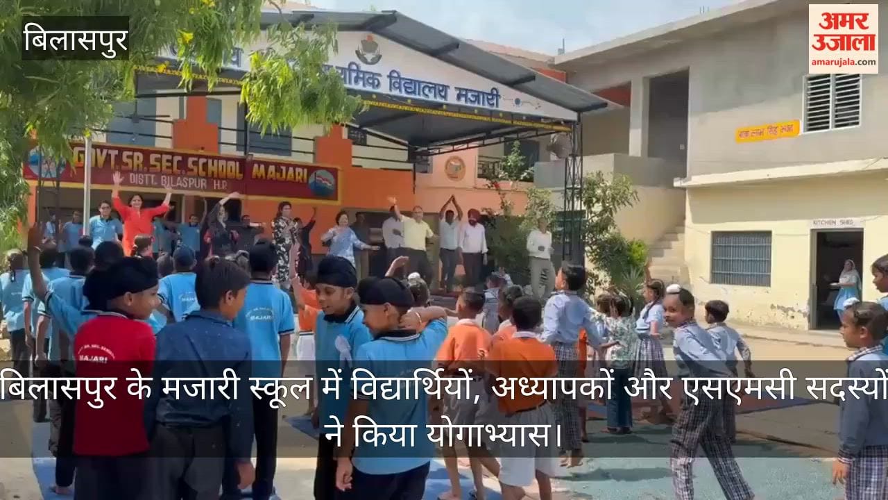 Students, teachers, and SMC members practiced yoga at Majari School in Bilaspur.