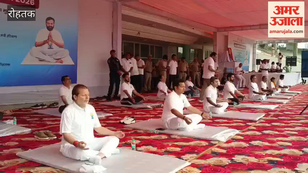 Cooperation Minister Dr. Arvind Sharma and administrative officials practiced Shashank Asana in Rohtak on International Yoga Day.