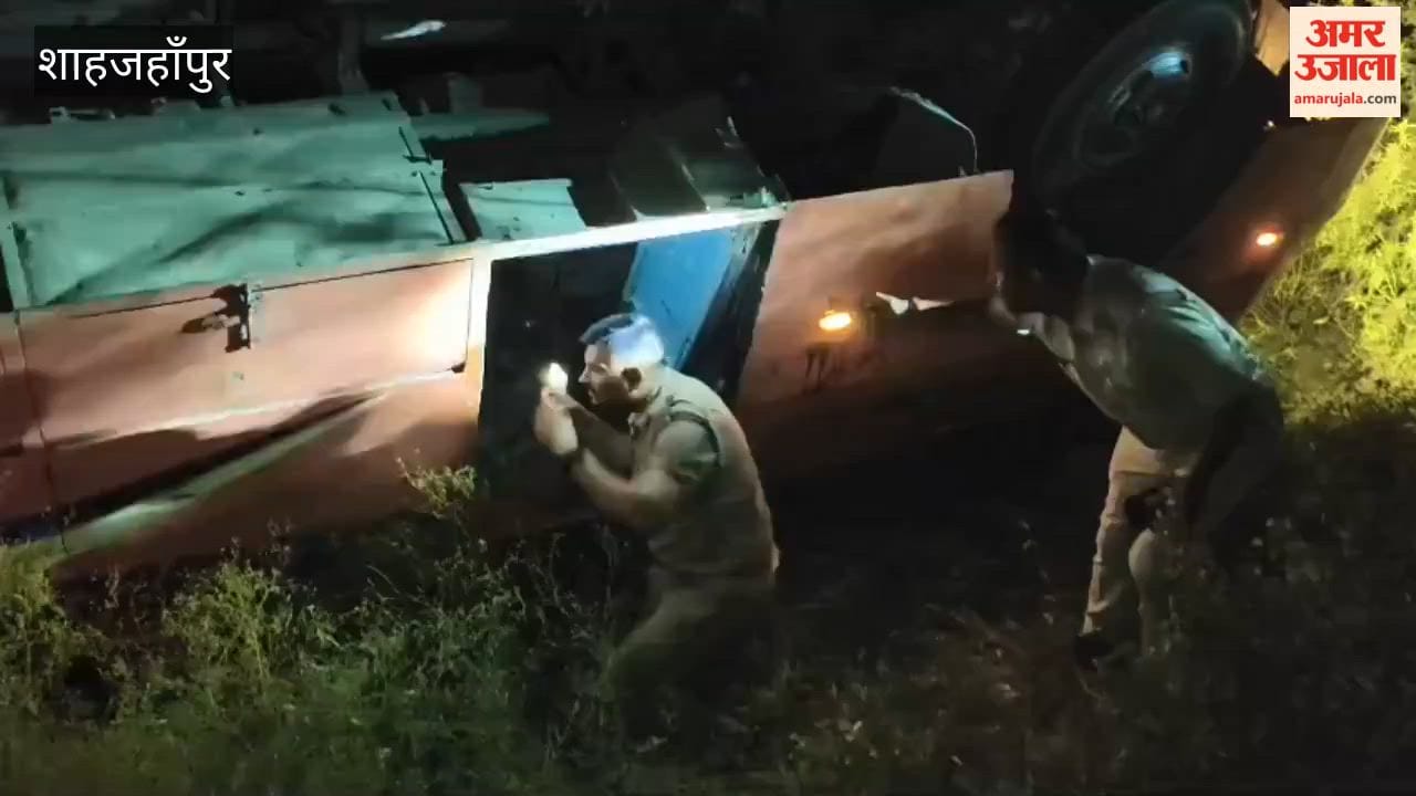 Private bus overturns from highway into ditch in Shahjahanpur