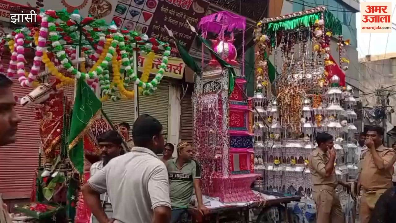 Chants of 'Ya Hussain' echoed during the Tazia procession passing through the Sarafa market.