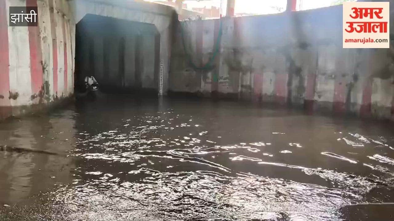 Water accumulated in the railway underpass after just light rain, causing trouble for commuters; the water could not be drained even after 12 hours.