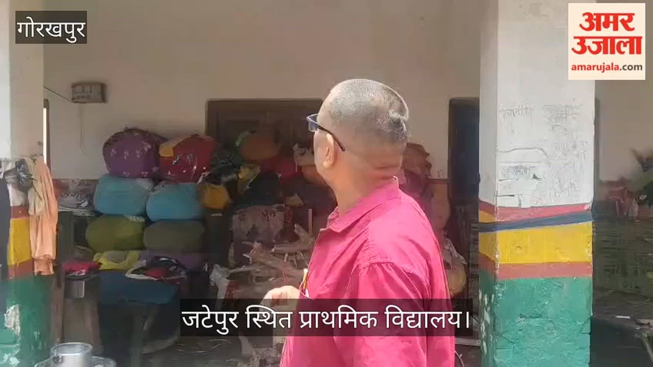 Primary school or community shelter? School gate turned into a bedroom—people living there with cots and bedding.