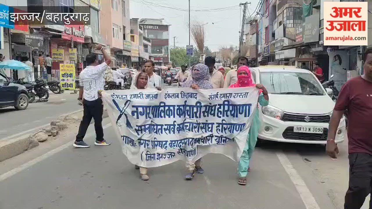 Sanitation workers in Bahadurgarh stage a 'broom protest' over unfulfilled demands; warn of renewed agitation.