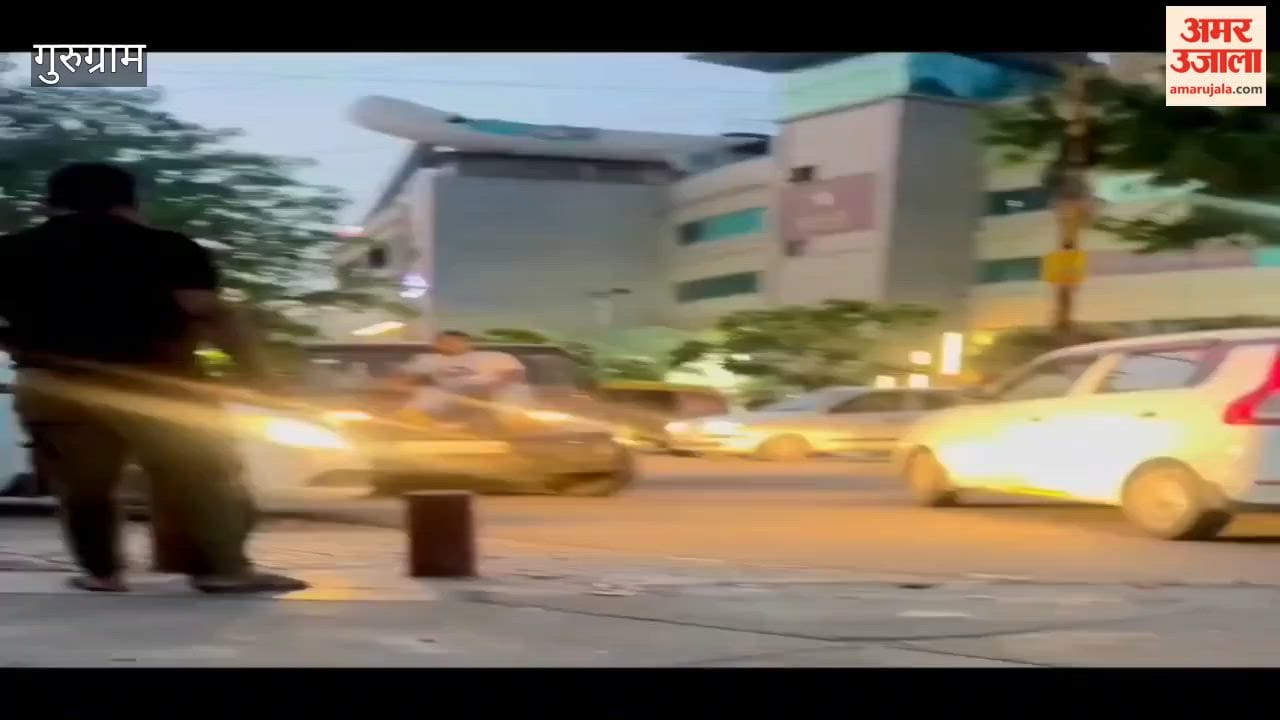 young man performed stunt while sitting on bonnet of Bolero vehicle on MG Road