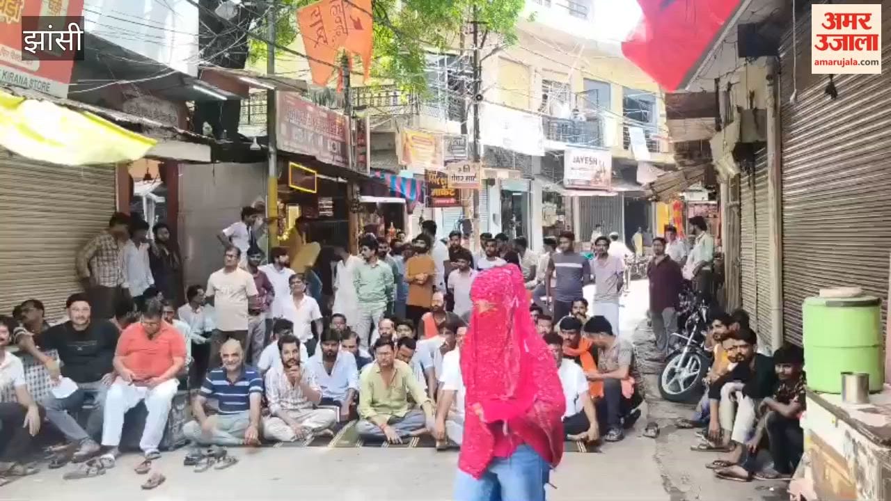 Traders stage a sit-in protest against the exhibition being held at the Mauranipur fairgrounds.