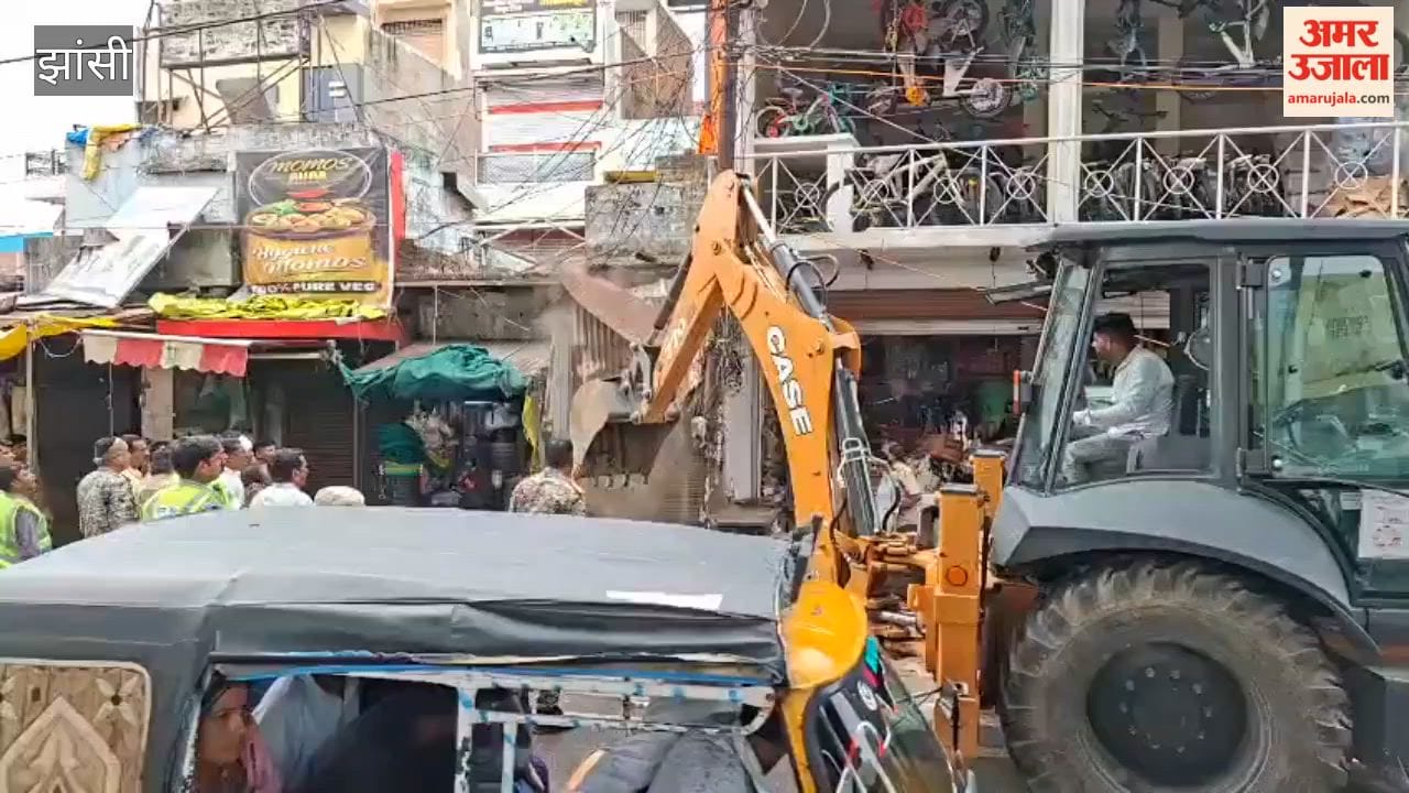 Municipal Corporation's bulldozer targets encroachments; three-day deadline given to remove over 20 shops built on Nazul land.
