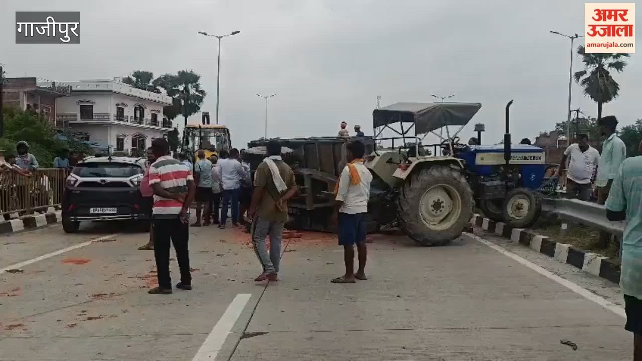 Violent collision between tractor-trolley and car; driver critical
