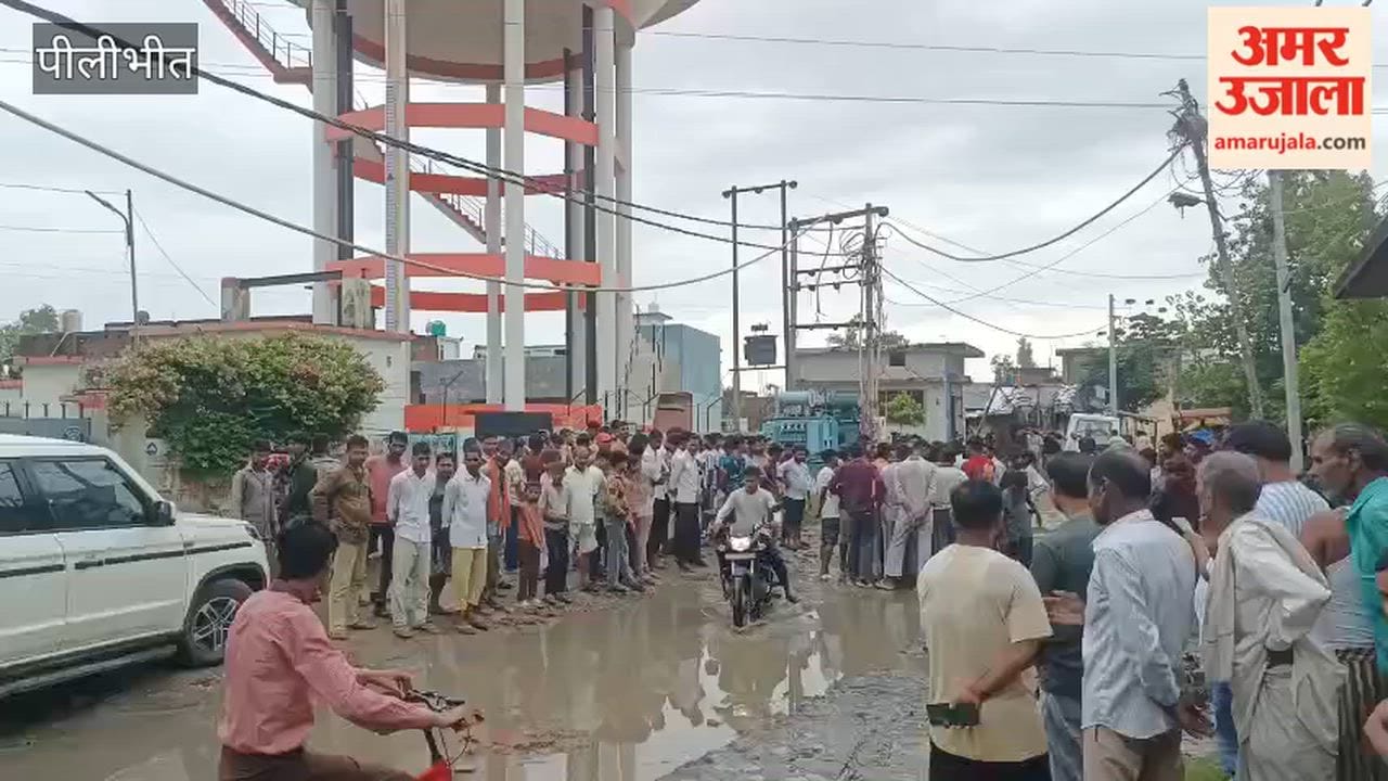 Villager climbs water tank for road construction in Pilibhit