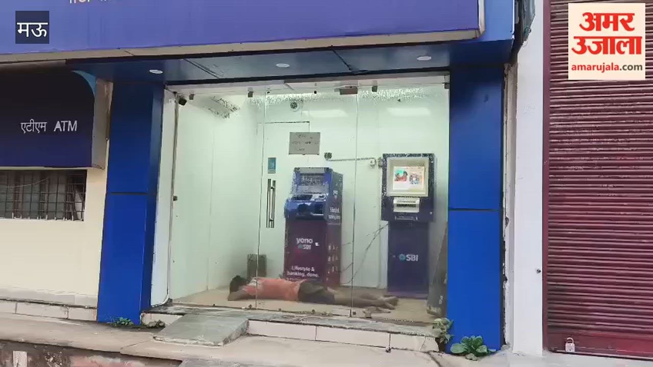 ATM becomes a temporary shelter from the heat; young man falls asleep to escape the scorching weather