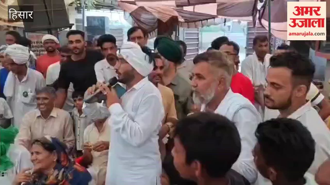 Hansi Deputy Commissioner Rahul Narwal visited Chanaut village; villagers expressed their gratitude by offering him *laddus*.