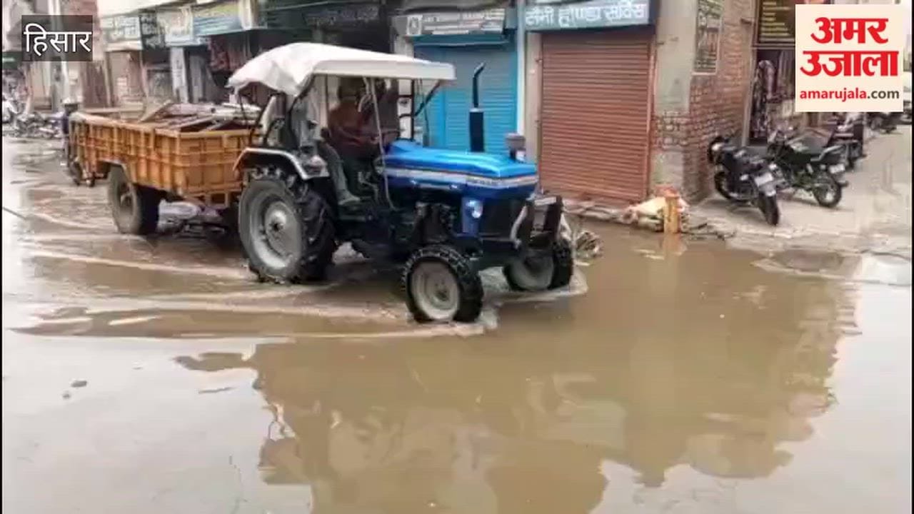 Sewage floods the street in Barah Quarter; protest staged by placing posters of the MLA and Mayor in the filthy water.