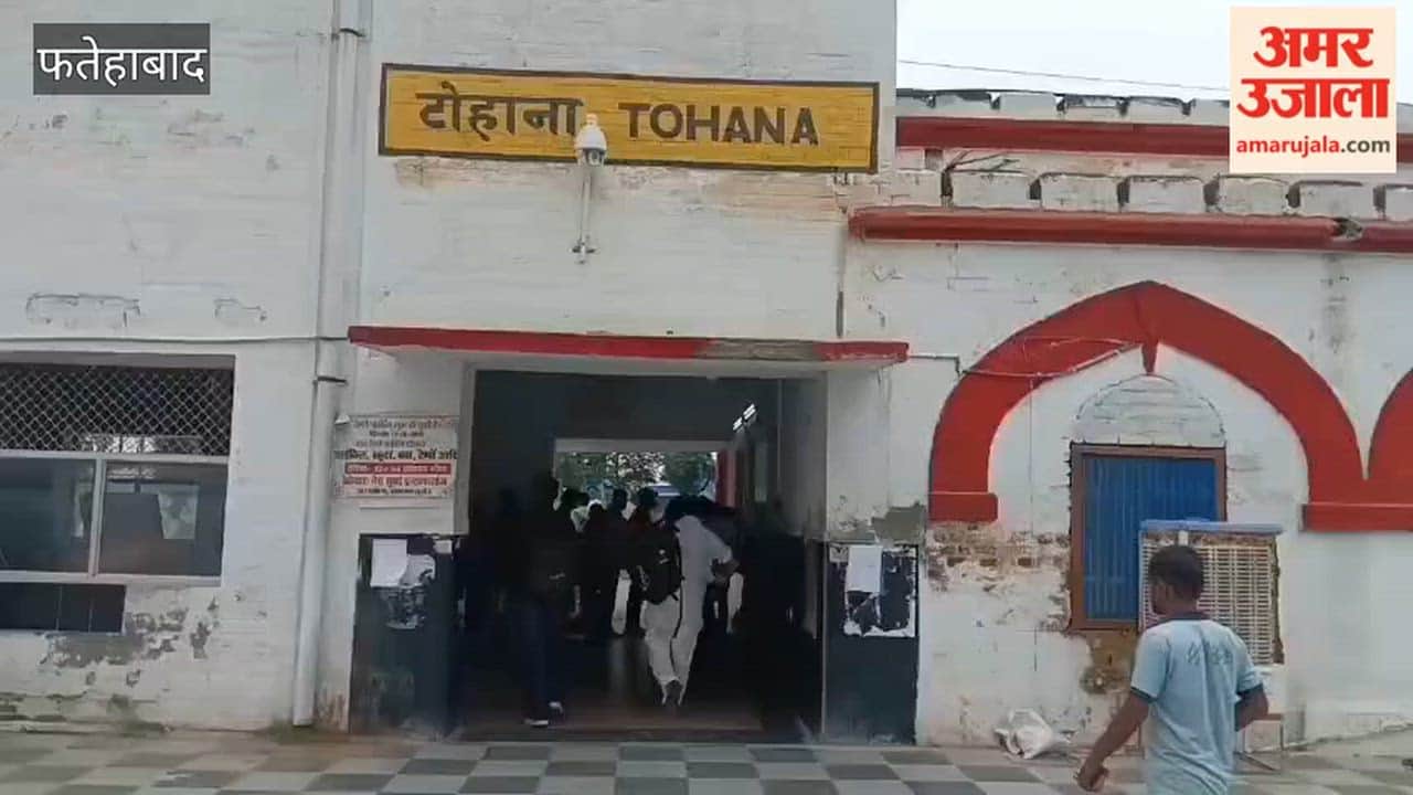 Police conduct flag march at Tohana railway station; security stepped up in view of the farmers' protest.