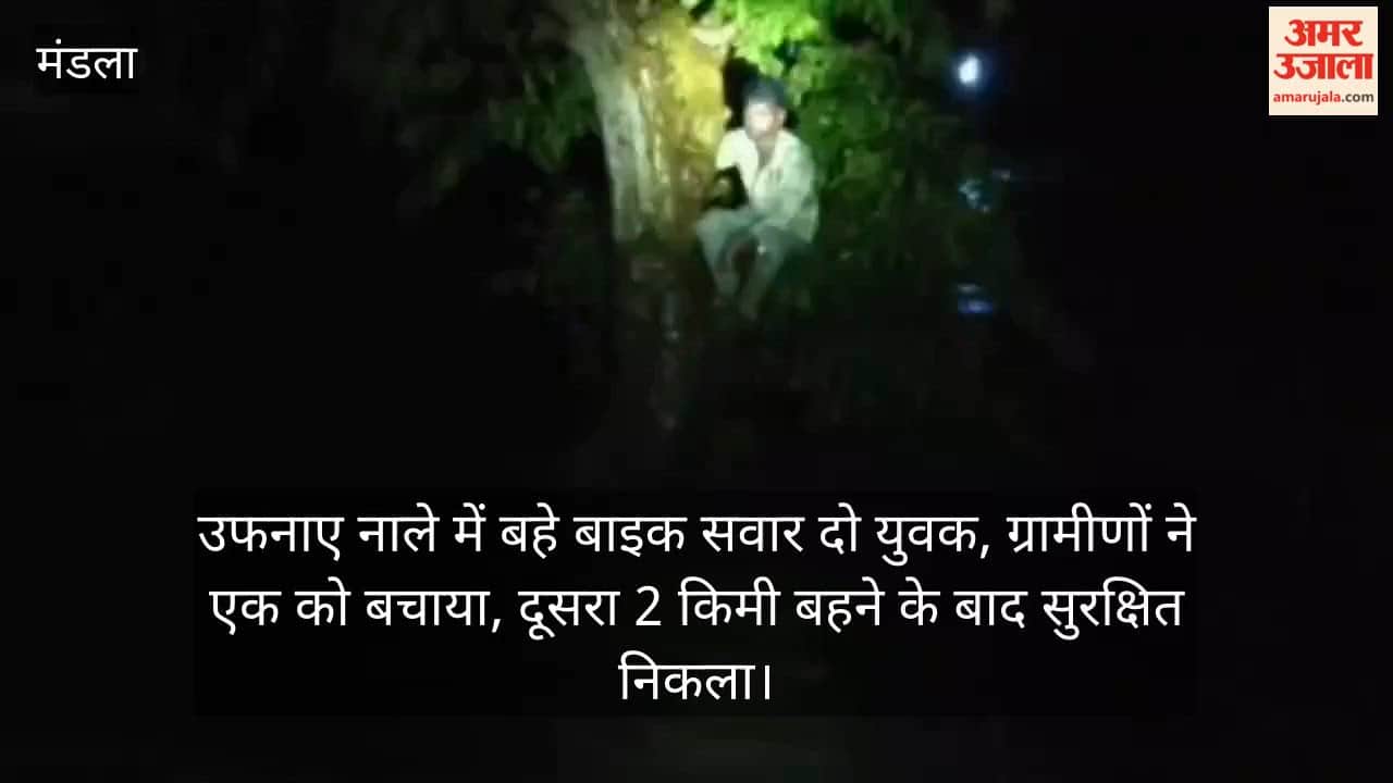 Two young men on a bike were swept away in a swollen drain; villagers rescued one, while