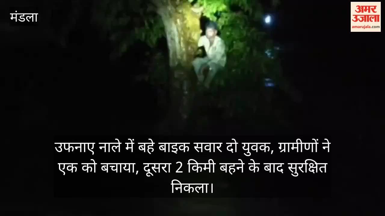 Two young men on a bike were swept away in a swollen drain; villagers rescued one, while