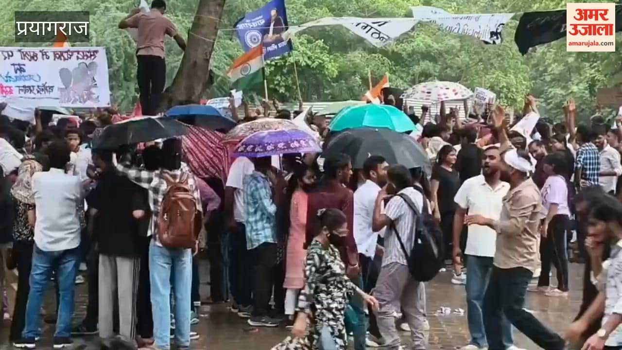 Heavy rain began during the students' protest; the students continued to raise slogans against the central government while getting drenched.