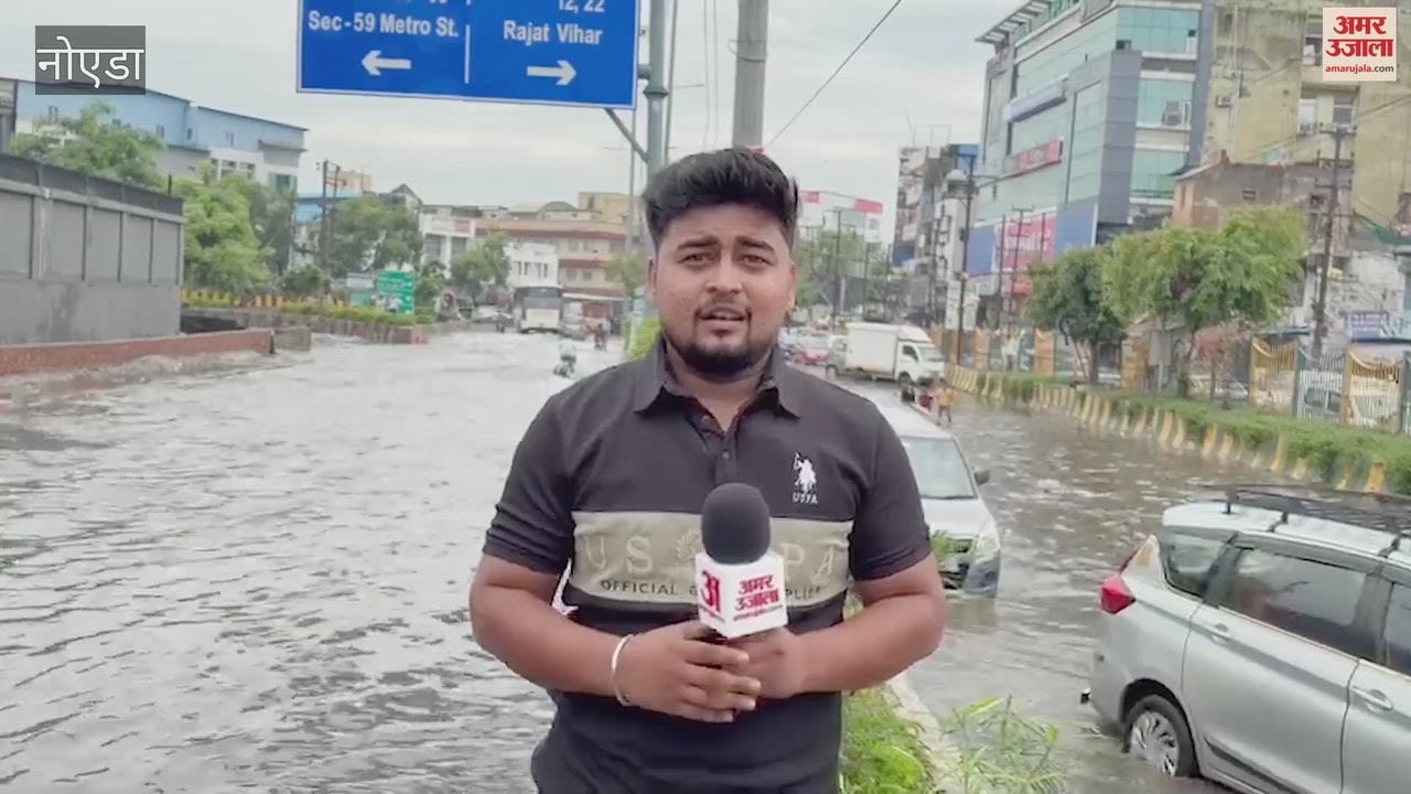 Rain turns roads into ponds at Labour Chowk in Noida Sector 62