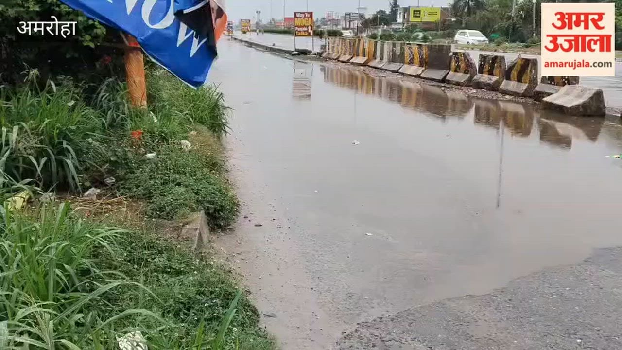 Waterlogging on the highway service road due to light rain.