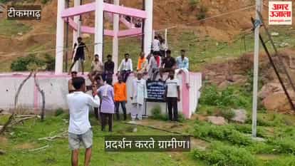 Women climbed a water tank over the water supply issue; administration officials are at the scene.