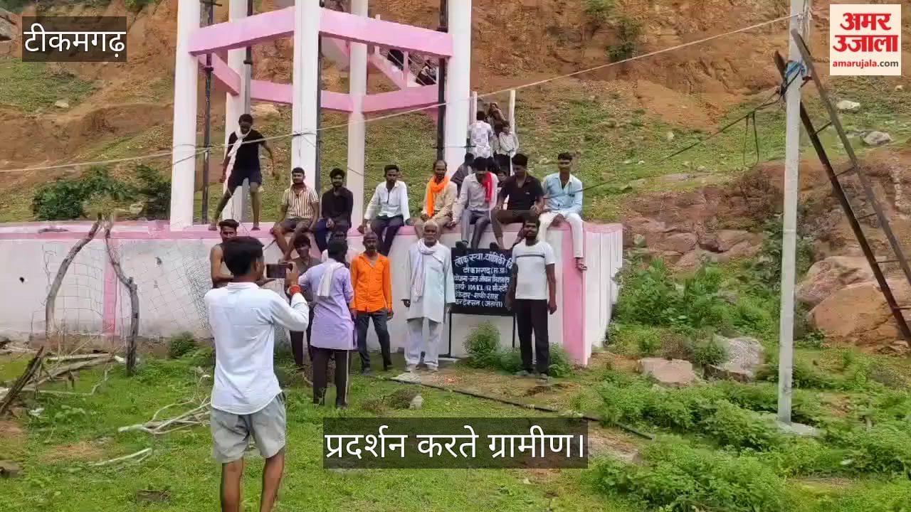 Women climbed a water tank over the water supply issue; administration officials are at the scene.