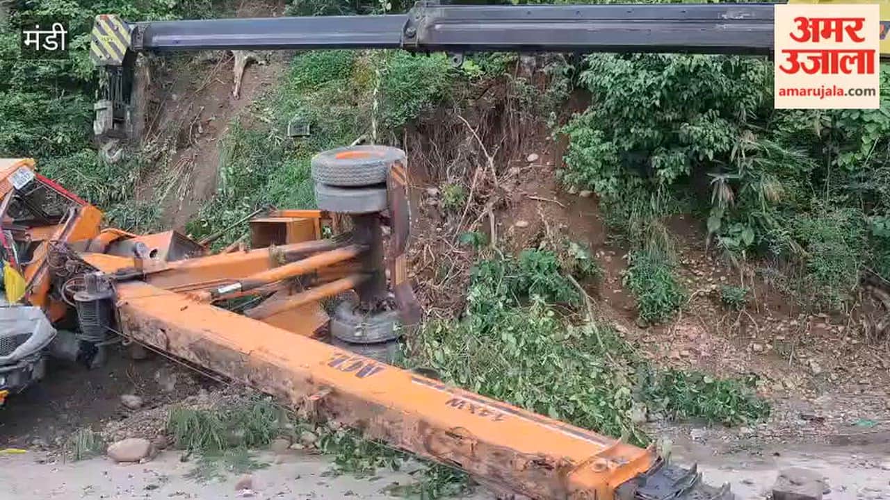 Major accident averted in Dharampur NH construction company hydra machine fell down a steep slope driver narrowly escaped