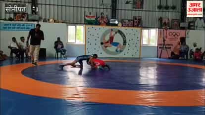 District-level wrestling competition: Kush from Gannaur wins in the 35 kg category, and Yogit from Sonipat wins in the 38 kg category.