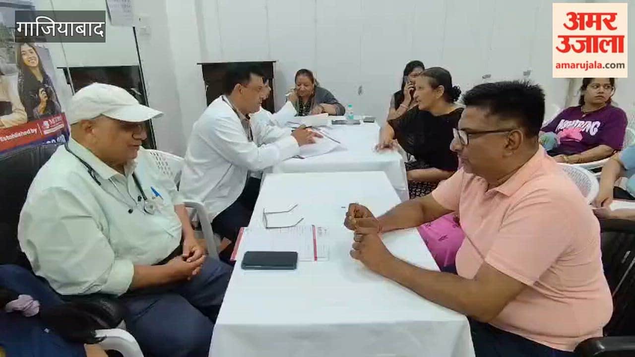 People arriving for check-ups at a health camp organized at Shipra Suncity community center in Ghaziabad
