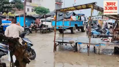 People sitting on a trolley with a body, covered in a plastic sheet to avoid getting wet in the rain.
