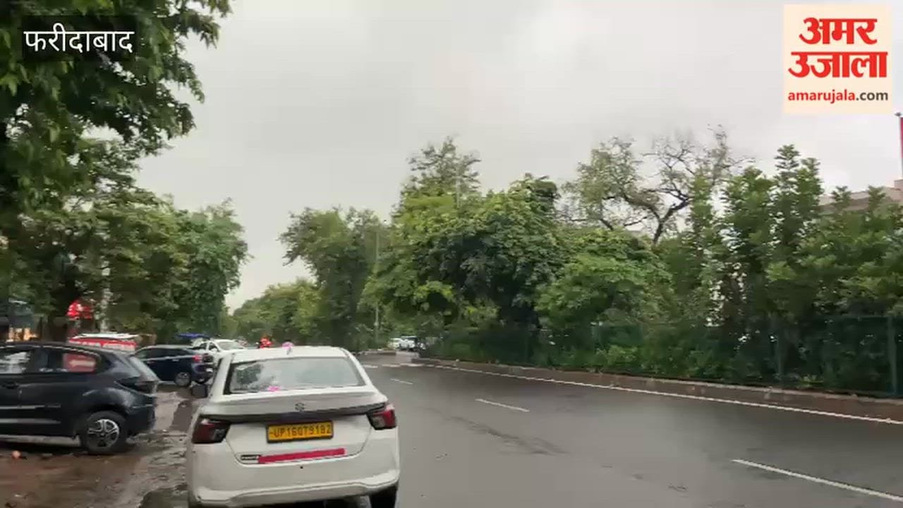 City residents get relief from the heat following rain; dark clouds gather in the sky.