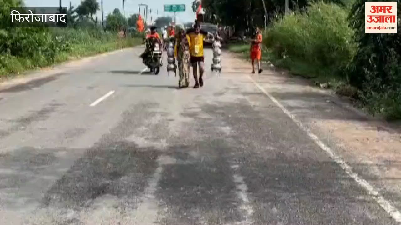 Husband and wife arrive in Tundla carrying a 51-kilogram Kanwar.