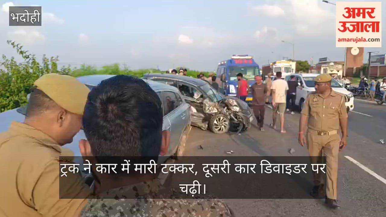 Truck hits car, second car climbs onto divider