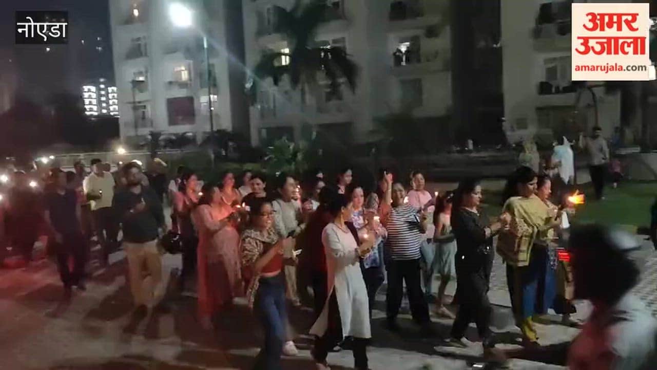 Candle march taken out in Greater Noida in protest against increase in cam fee