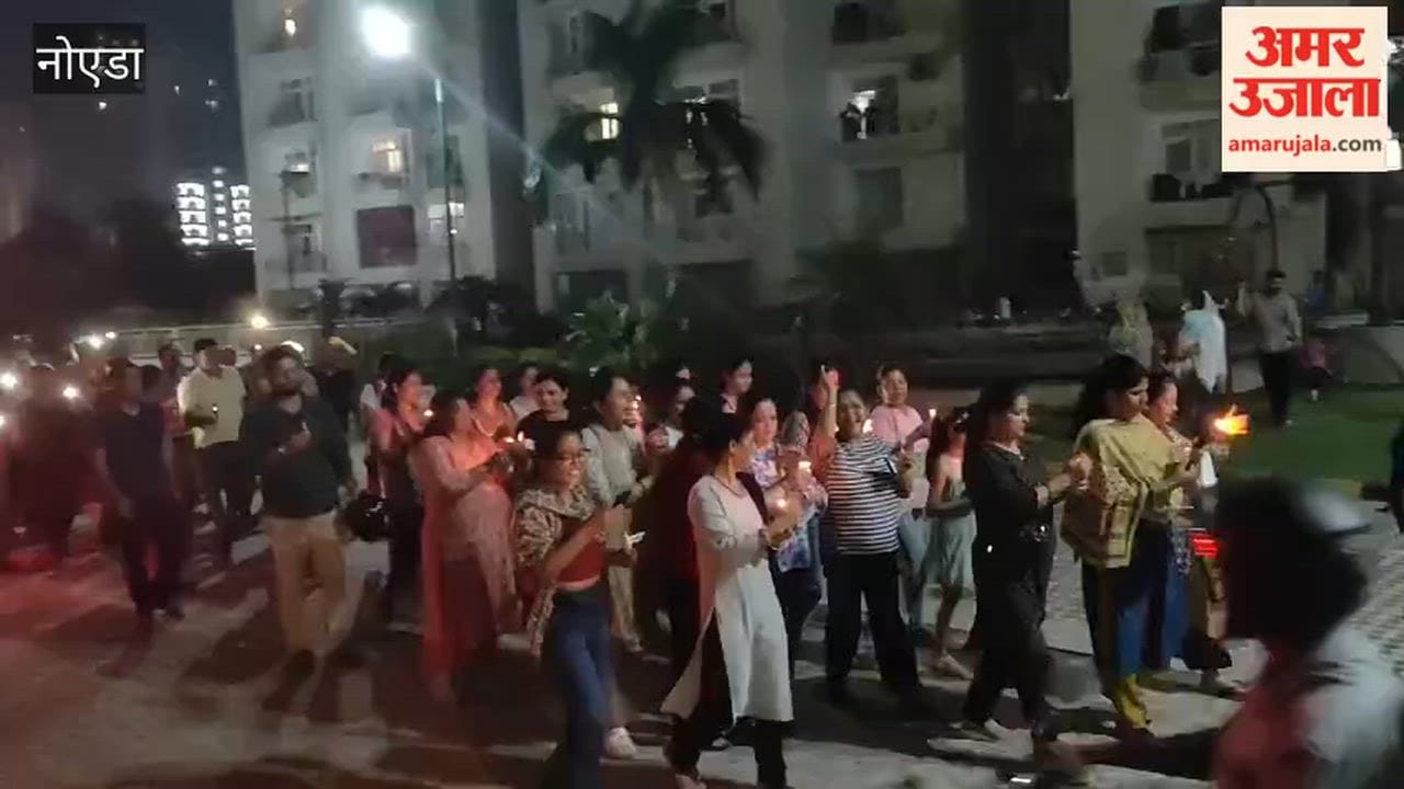 Candle march taken out in Greater Noida in protest against increase in cam fee