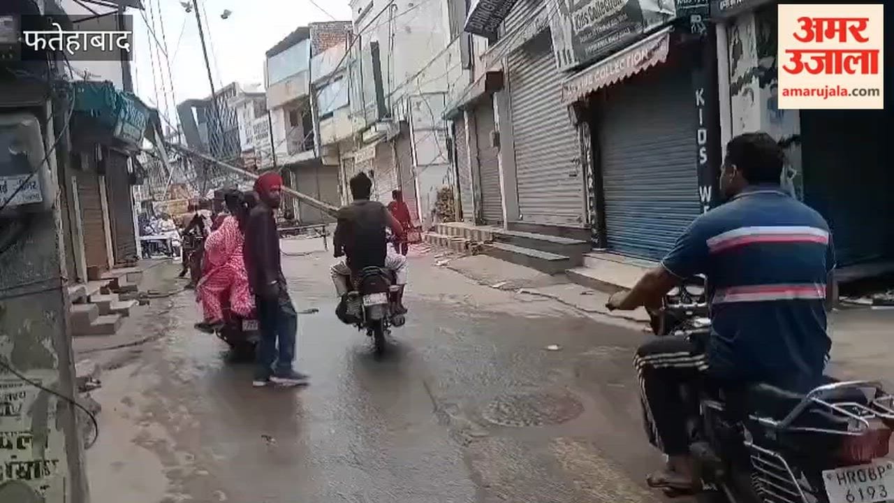 electricity pole fell onto a shop in the timber market of Tohana, Fatehabad, causing minor injuries to three people