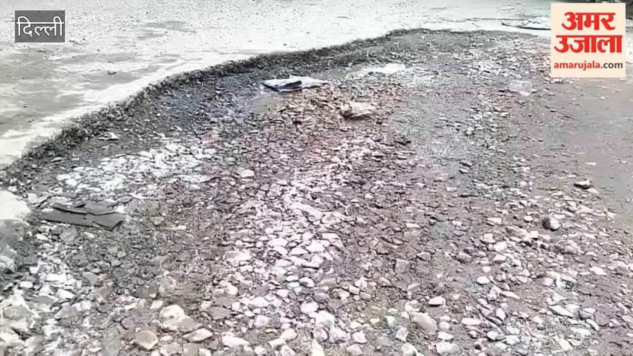 Potholes in road or road in potholes state of Delhi's roads after rain