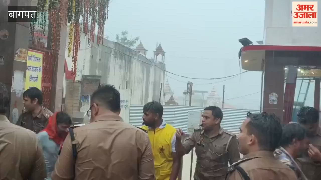 Baghpat: Kanwariyas Continue Jalabhishek Amid Rain at Pura Mahadev Temple