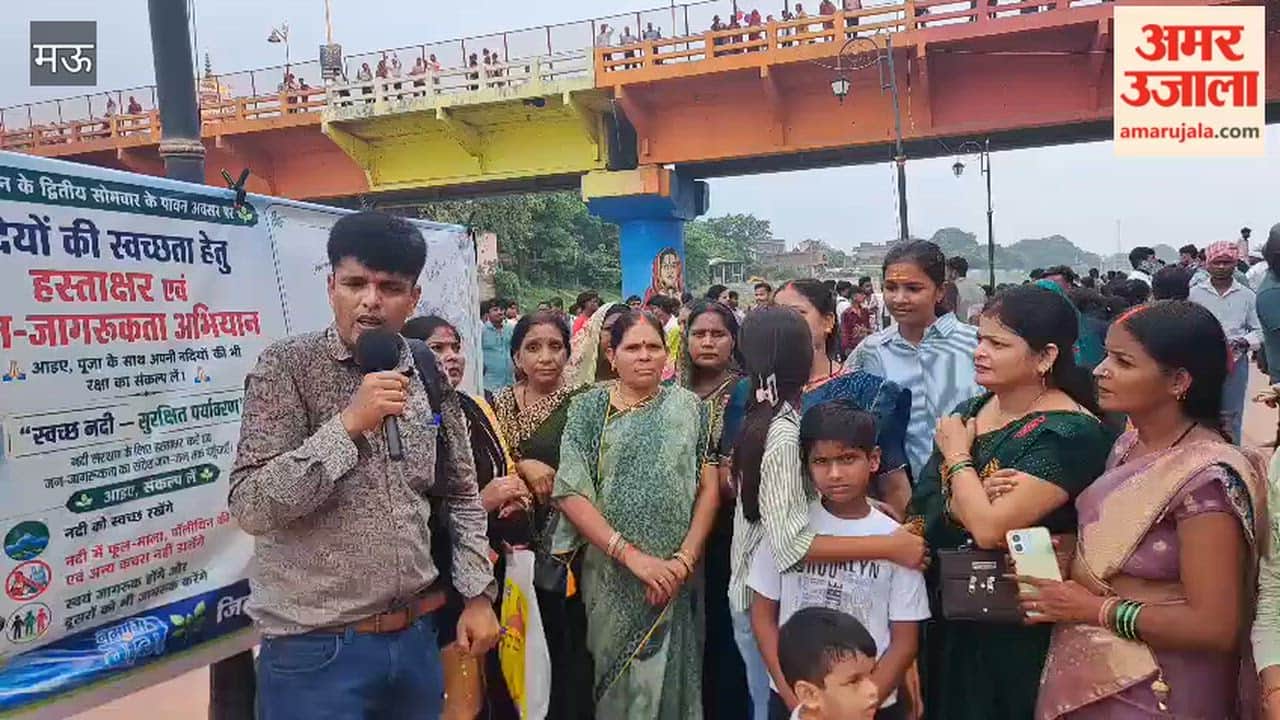 People pledge for cleanliness by signing on the banks of the Tamsa